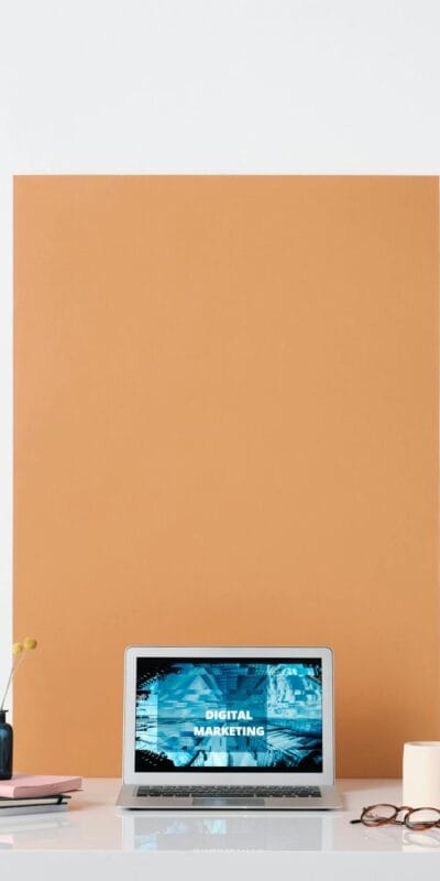 Modern workspace featuring a laptop with a digital marketing screen, ideal for business and technology themes.