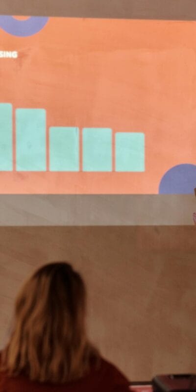 Young professional presenting data with graph in a business meeting.